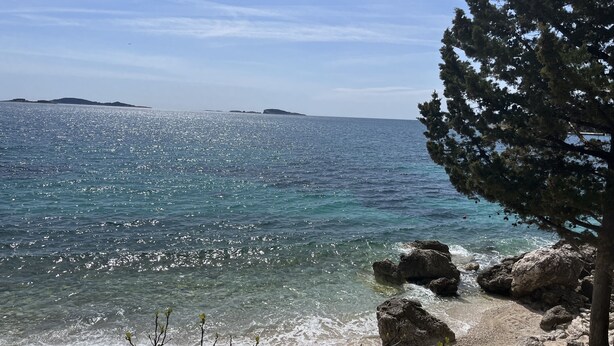 A coastal view with clear water, rocky shoreline, and distant islands. - Magnificent Newly-built Villa in Mlini with Private Pool and Near Beaches (20207 Mlini)