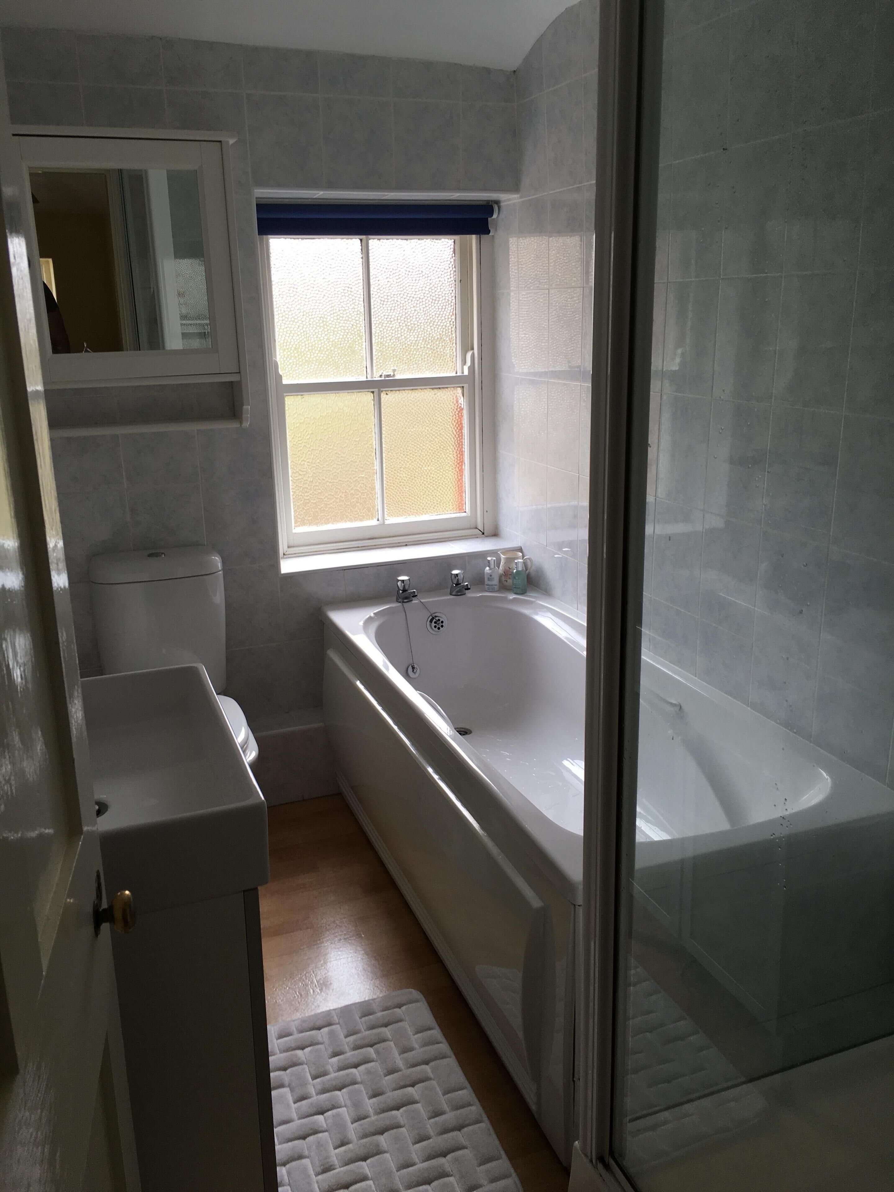 Bathroom with bath and separate shower