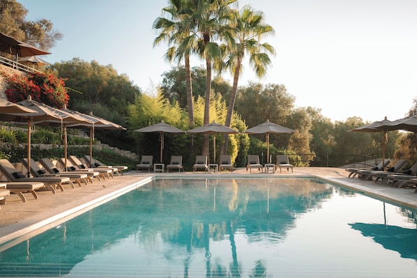 Indoor pool, pool umbrellas, pool loungers
