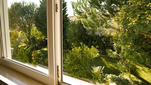 A window with a view of a garden.