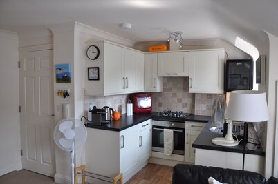 A lovely quiet new flat 50 yards from the beach in the centre, parking included.