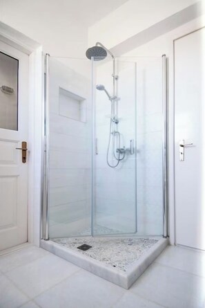 Shower, hair dryer, towels, toilet paper