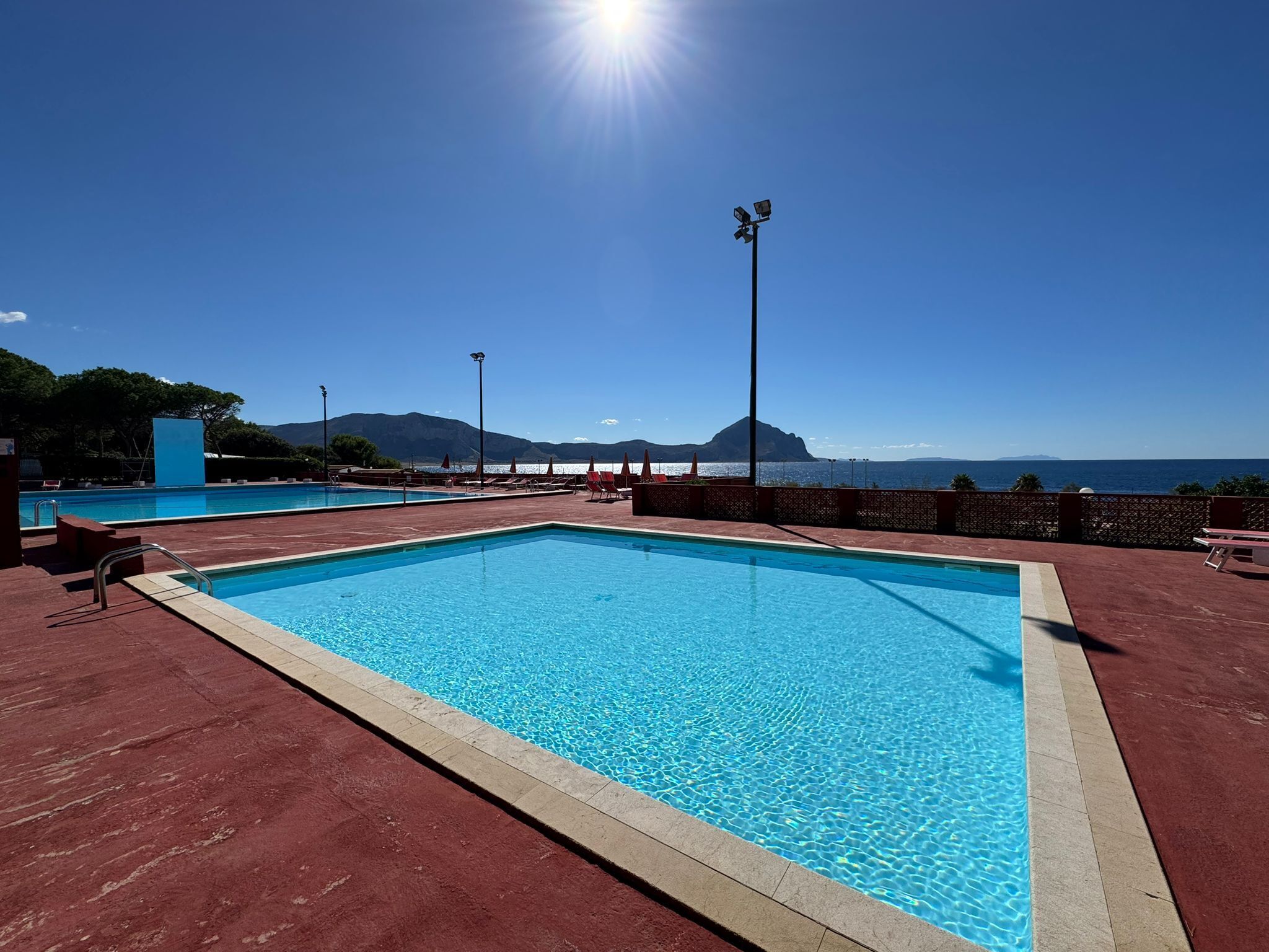 Seasonal outdoor pool, pool umbrellas, pool loungers