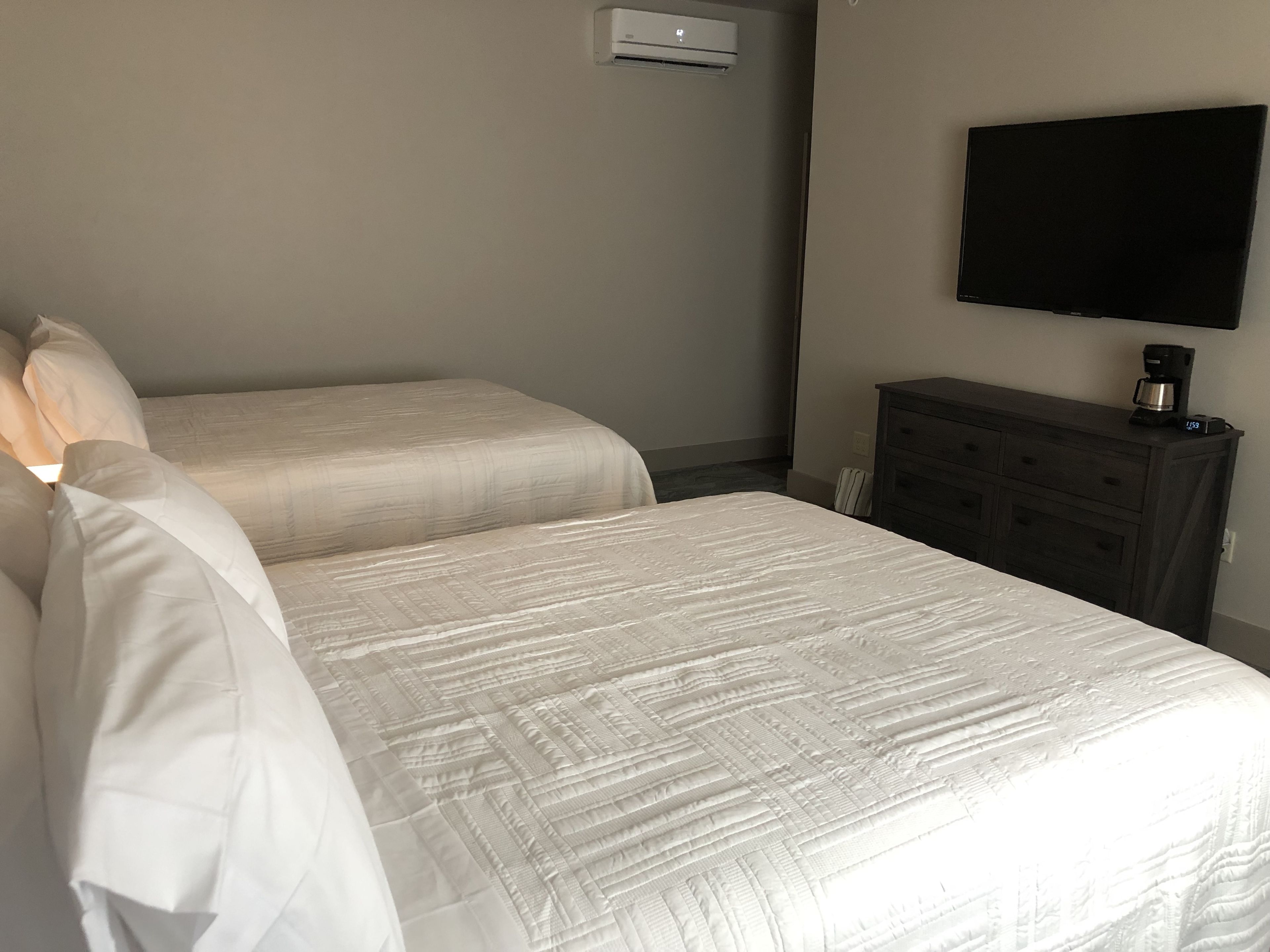 deluxe quadruple room, 2 queen beds, non smoking | in-room safe, blackout curtains, iron/ironing board, free wifi