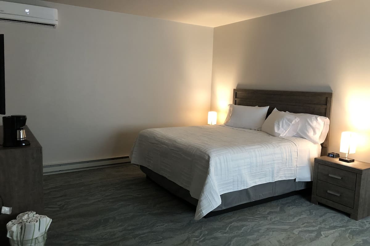 deluxe quadruple room, 1 king bed with sofa bed, non smoking | in-room safe, blackout curtains, iron/ironing board, free wifi