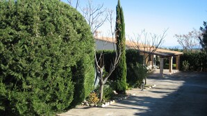 A paved driveway leading to a covered patio area with a pergola. - CAN LA (Wi-Fi Villa) (Pollensa)