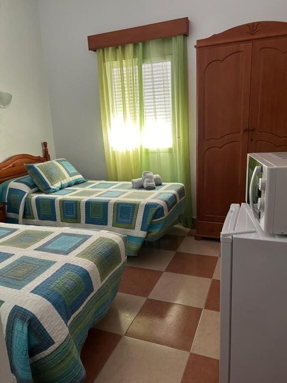 Habitación superior, 2 camas individuales | Wifi gratis y ropa de cama