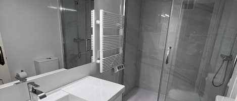 Shower, hair dryer, towels, toilet paper