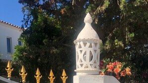 A gated entrance with a white wall, a decorative lantern, and a sign reading "VILA NUNO". - 3 bed Villa with Private Pool and Gardens- sleeps 6/8. 5min stroll to village.  (Olhos'de agua)