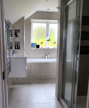 Combined shower/tub, hair dryer, towels, toilet paper