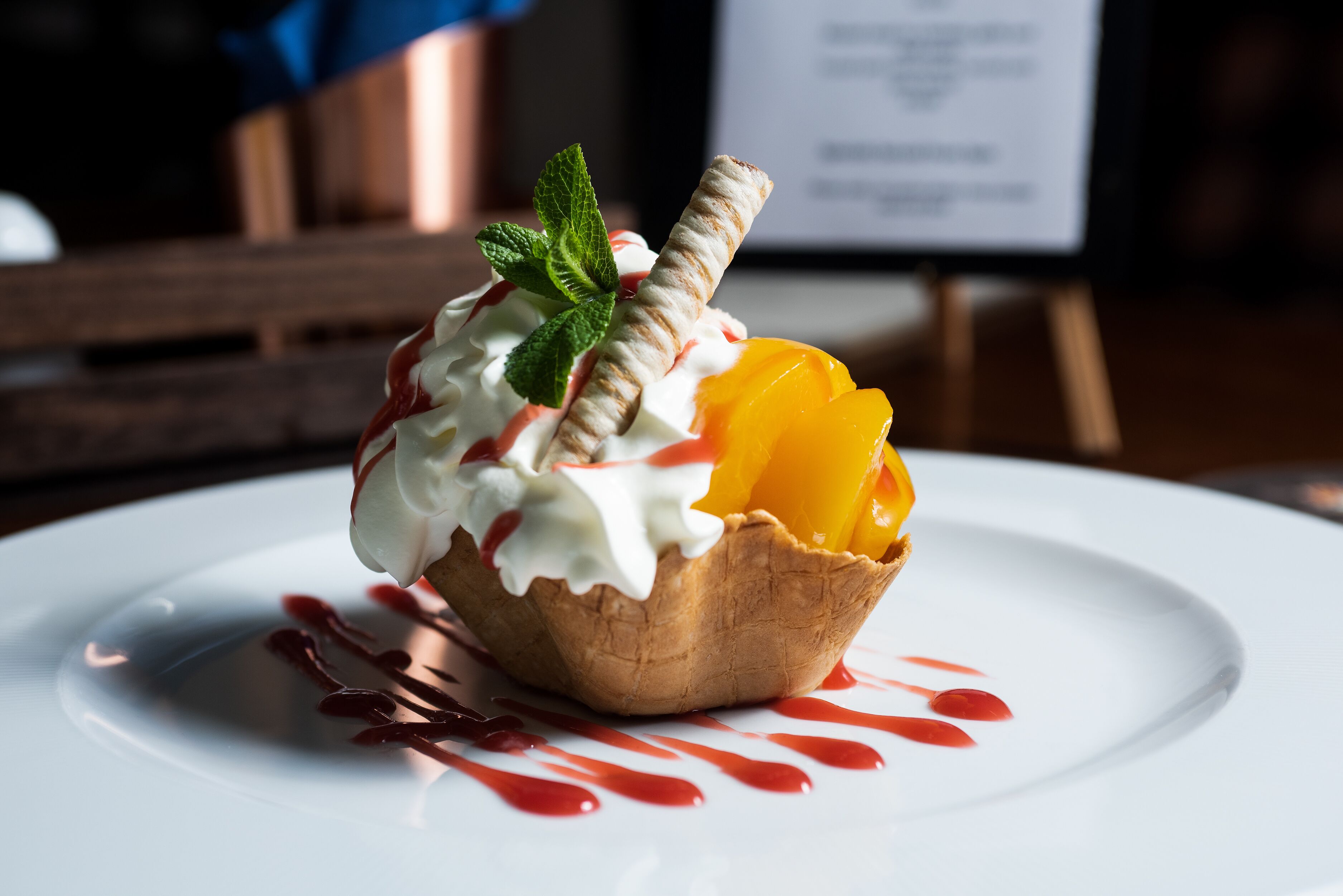 A dessert on a white plate with a wooden background.