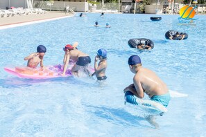 Seasonal outdoor pool, open 9:00 AM to 7:30 PM, pool umbrellas