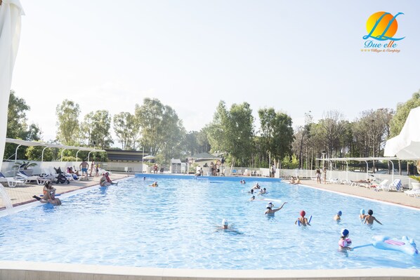 Seasonal outdoor pool, open 9:00 AM to 7:30 PM, pool umbrellas
