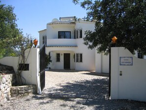 Front entrance with electric gates.