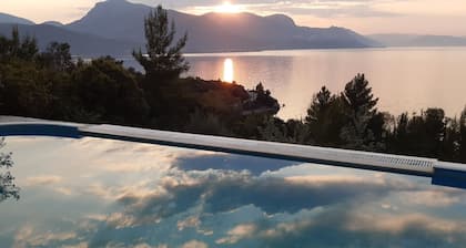 A modern villa in a unique setting with stunning views. The real Greece.