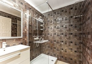 Shower, hair dryer, towels, toilet paper