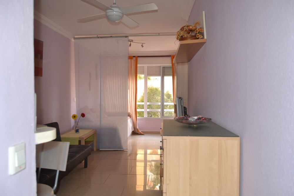 Apartment on the beach, next to the lighthouse, with air conditioning and swimming pool.
