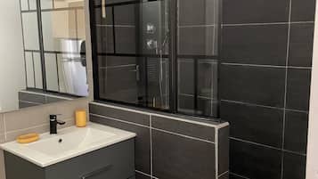 Shower, hair dryer, towels, toilet paper