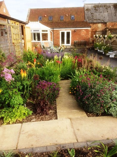 Holiday cottage in rural setting within quiet coastal village.