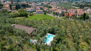 An aerial view of a residential area with houses, a swimming pool, and a garden. - PRIVATE POOL - FARMHOUSE FATTORIA LA PIEVE-VILLA FICO from Pisa (Calci Toscana)