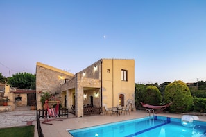 A heated pool, sun loungers