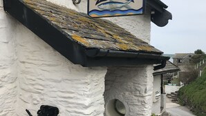 A white building with a sign reading "Pilchard Inn" and the number "1336". - Luxury Apartment, Magnificent Sea Views, Private Access to Beach, Bigbury-on-Sea (Bigbury on Sea)