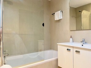 Combined shower/tub, hair dryer, towels, toilet paper