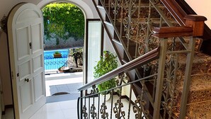 A staircase with ornate metal railings leading to a pool area. - Lovely 6 Bedrooms Villa With Pool, Located few Minutes From Sorrento Center (Sorrento)