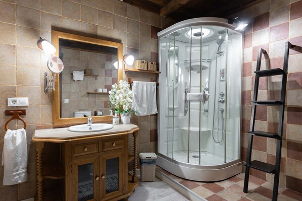 Shower, hair dryer, towels, toilet paper