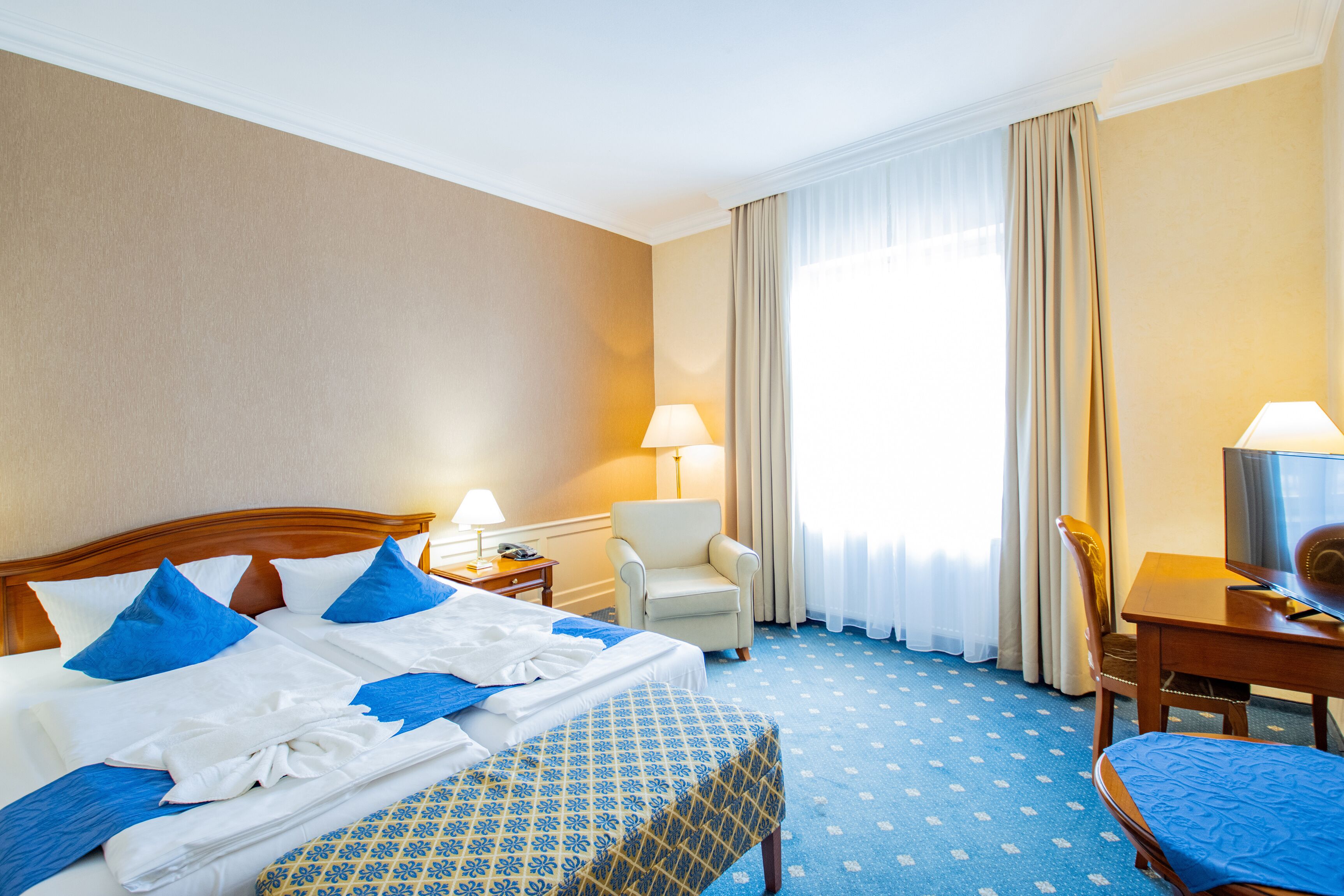 family room with connecting door in main building | 1 bedroom, individually decorated, individually furnished, desk