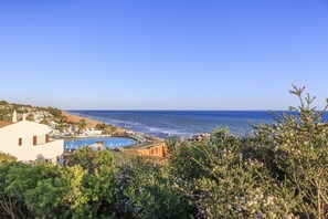 A coastal resort with a swimming pool, beach access, and lush greenery. - CASAS DA PRAIA, 56 (Almancil)