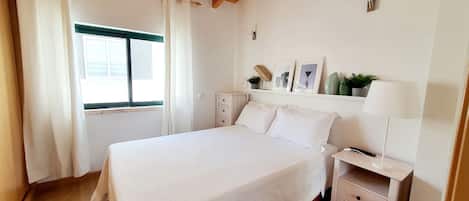 1 bedroom, desk, iron/ironing board, travel crib