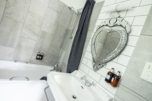 Combined shower/tub, hair dryer, towels, soap