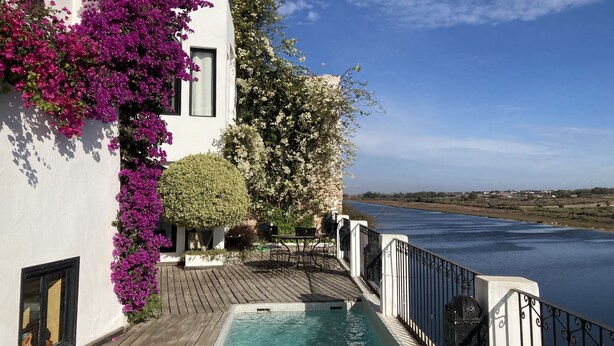 A poolside area with a wooden deck, a swimming pool, and a view of a river. - House with character (Azemmour)