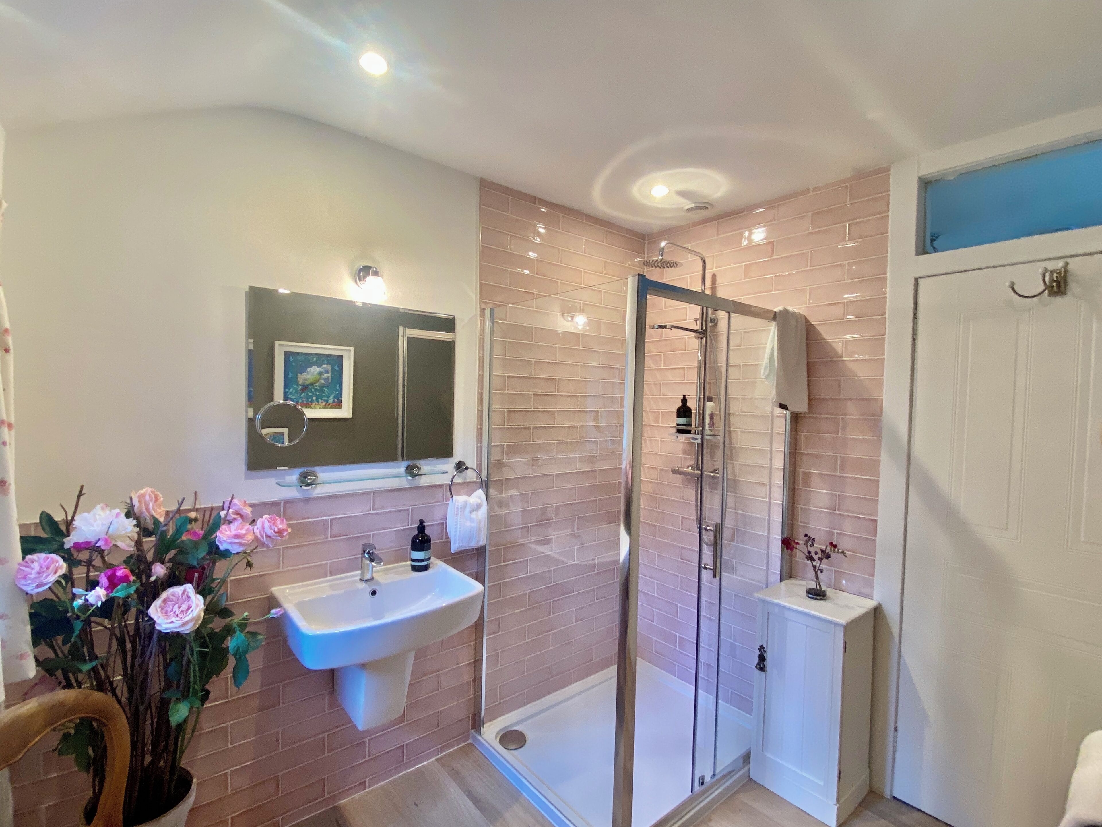 Bathtub, hair dryer, towels, toilet paper