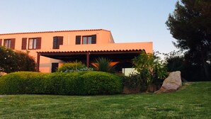 A modern two-story house with a flat roof and a covered patio area. - WONDERFUL VILLA ON THE SEA 8/10 PEOPLE  (Lumio)