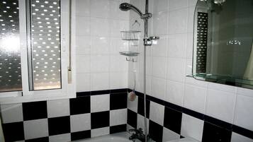 Combined shower/tub, hair dryer, towels, soap