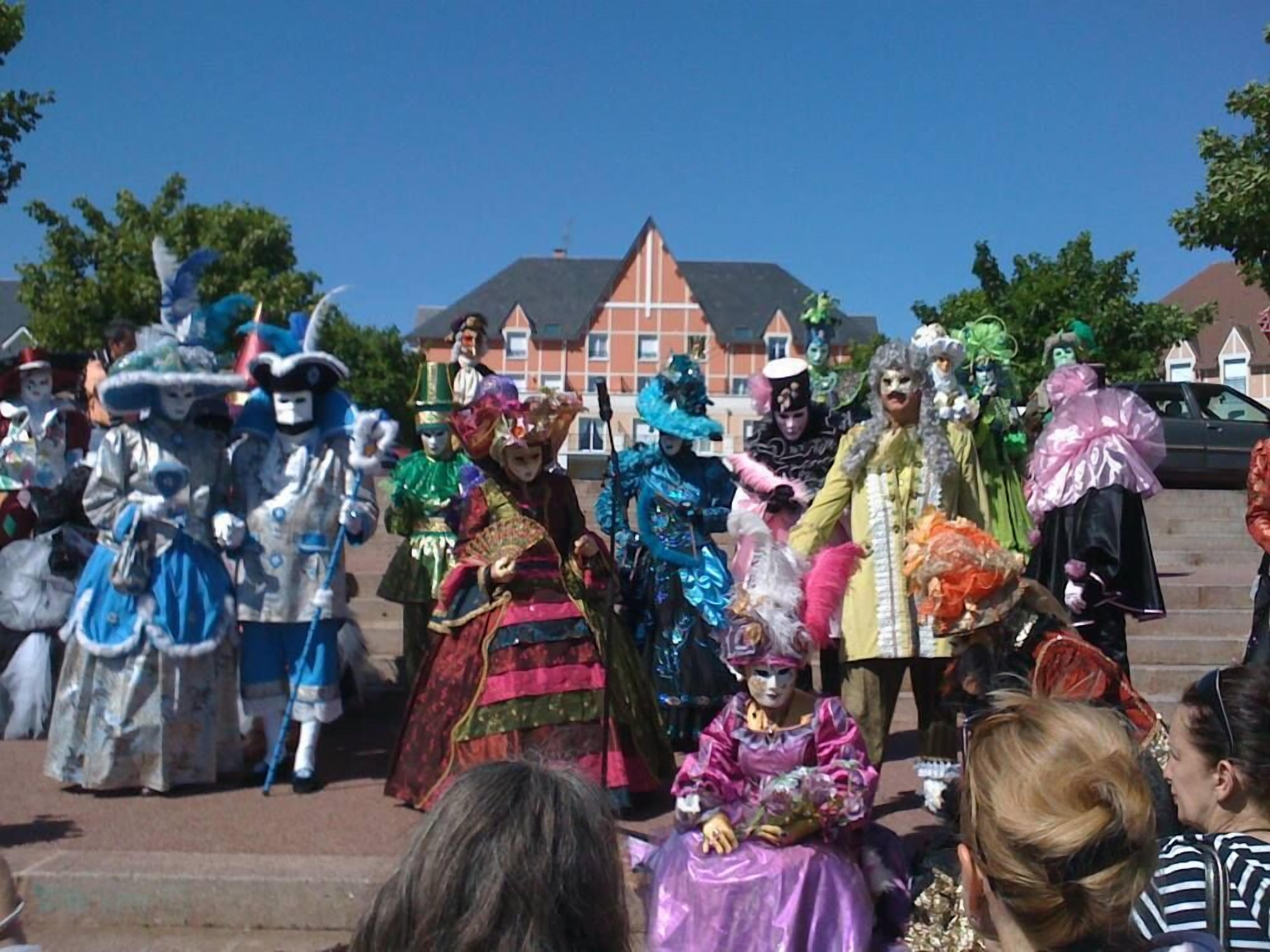 A group of people in colorful costumes standing on steps.