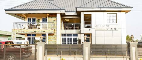 A two-story building with a sign reading "JEYADS LODGE".