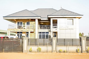 A two-story building with a sign reading "JEYADS LODGE".