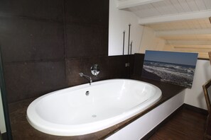 Bathtub, hair dryer, towels