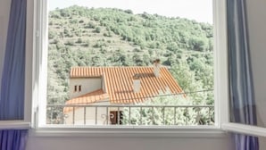 A room with a window overlooking a hillside. - Large fully air conditioned luxury villa with pool in beautiful location (Reynès)