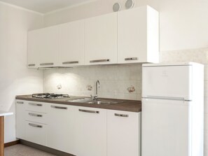 Fridge, coffee/tea maker, toaster, cookware/dishes/utensils