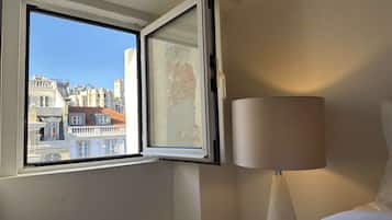 1 bedroom, desk, iron/ironing board, travel crib