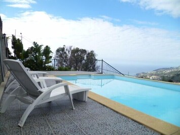 View of sea and coastline to Ponta da sol from your private heated pool