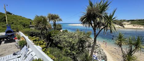 On the beach, sun-loungers, beach towels