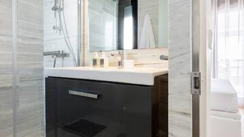 Shower, rainfall showerhead, hair dryer, towels