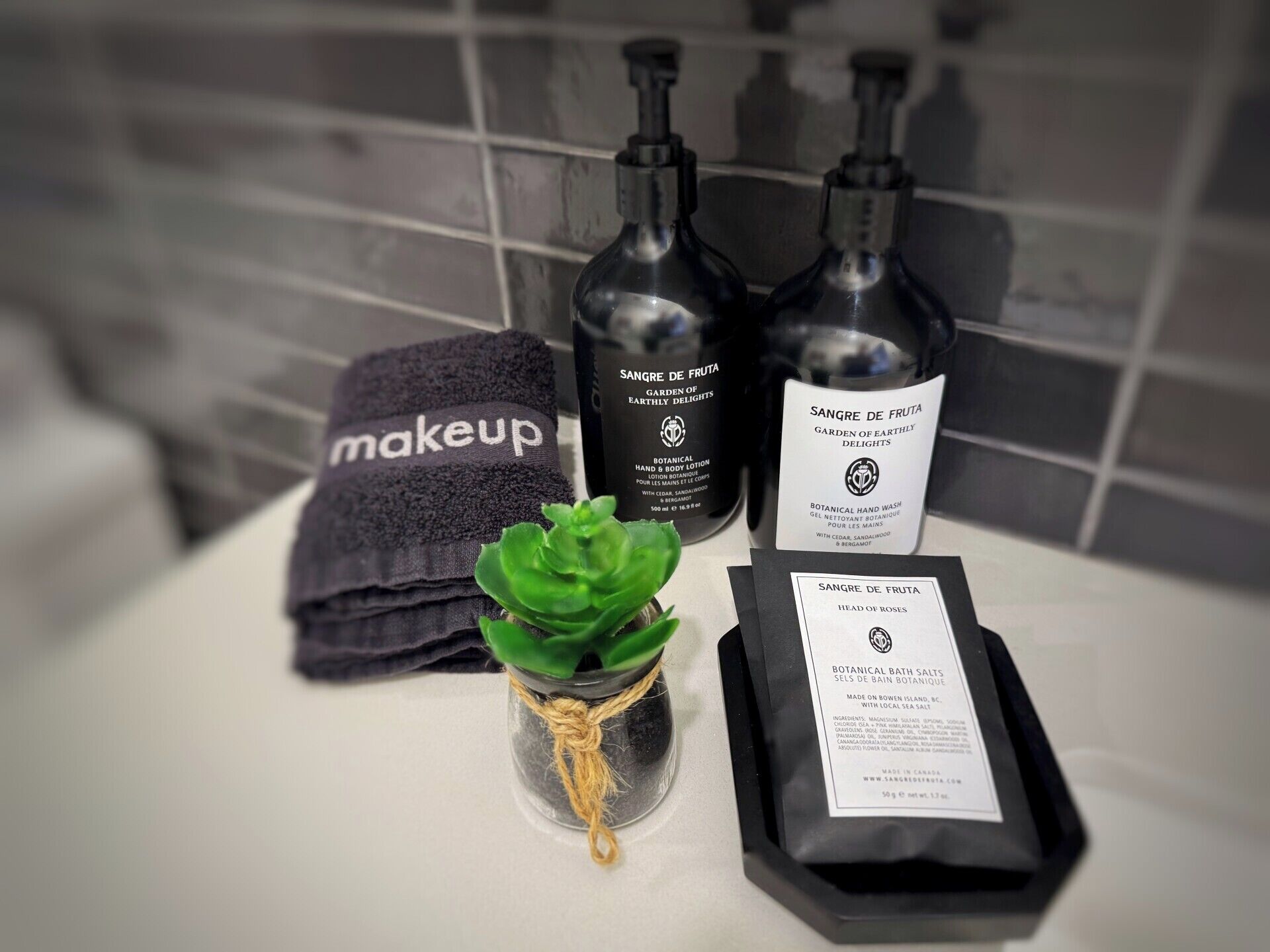 designer toiletries, hair dryer, towels