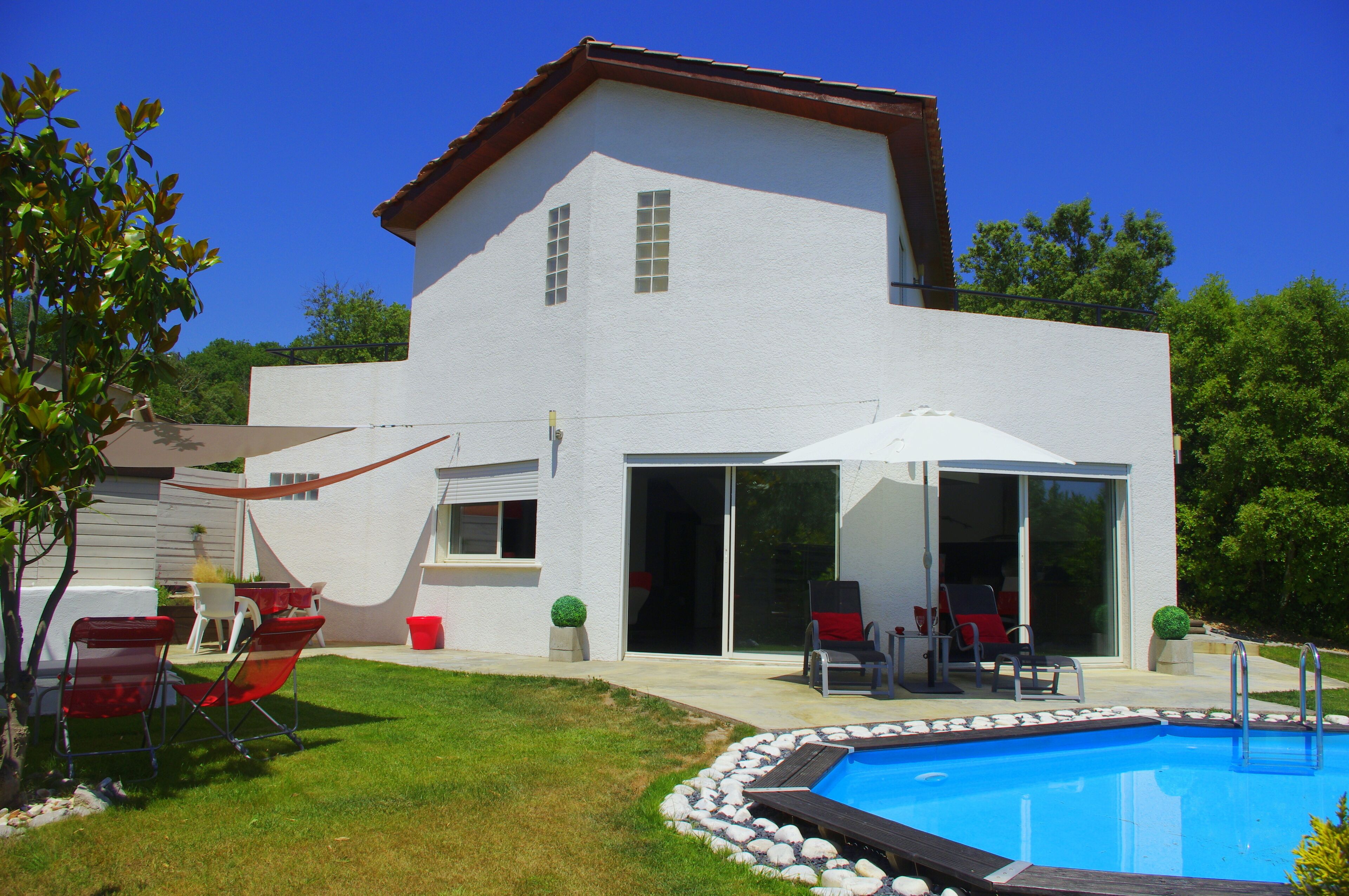 Contemporary house  with garden and pool