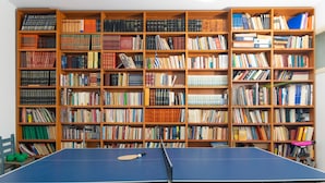 A room with a ping pong table and a large bookshelf filled with books. - Villa Kallergi - Nefeli (450 m2) House for 6, west-central Crete (Rethymnon)